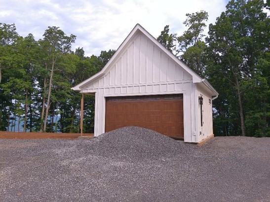 Deetached garage with a pile of gravel in Chicago, IL