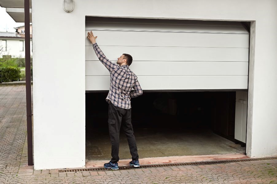A man opening his car garage
