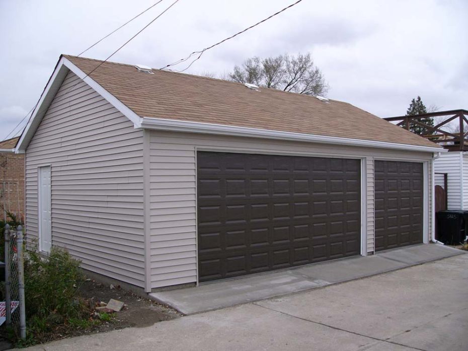 Residential garage building with two large garage doors